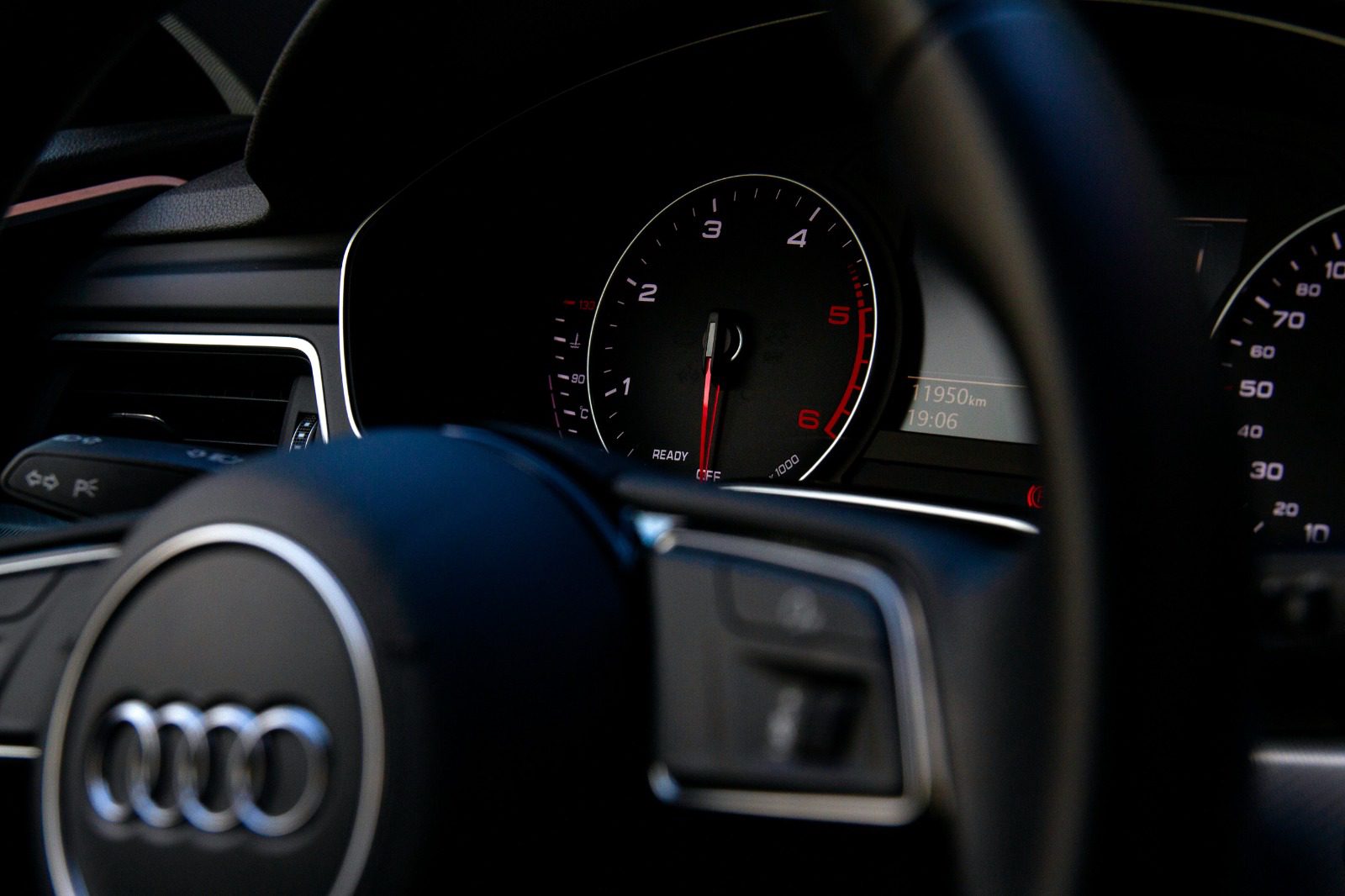 Audi instrument cluster close-up at idle, ready state